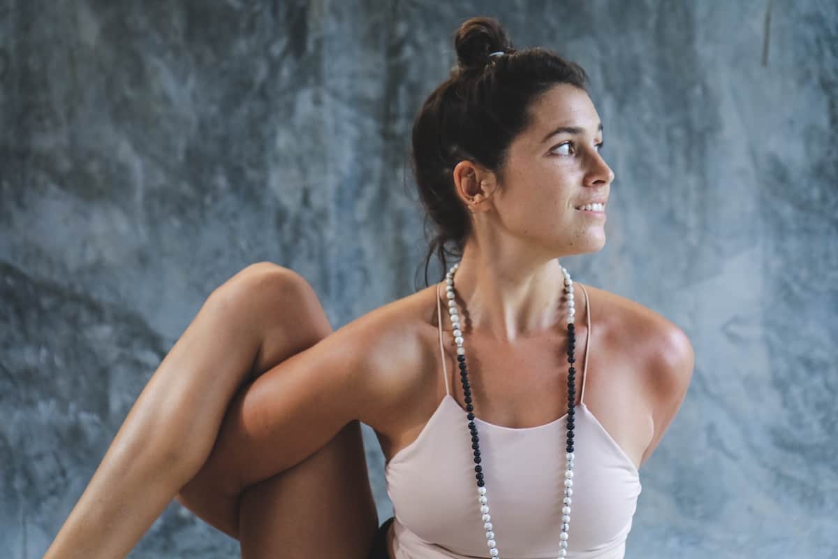 woman in yoga bind pose