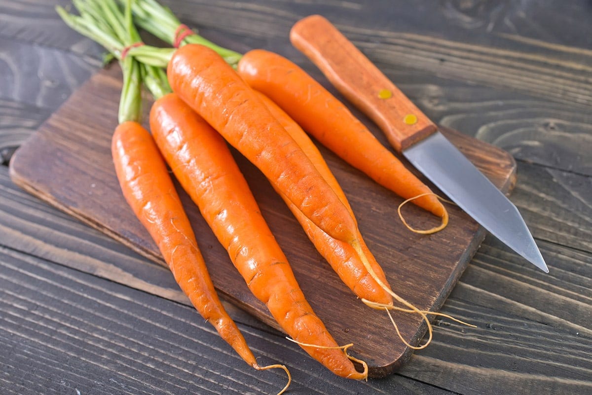 carrots on wooden cutting boad