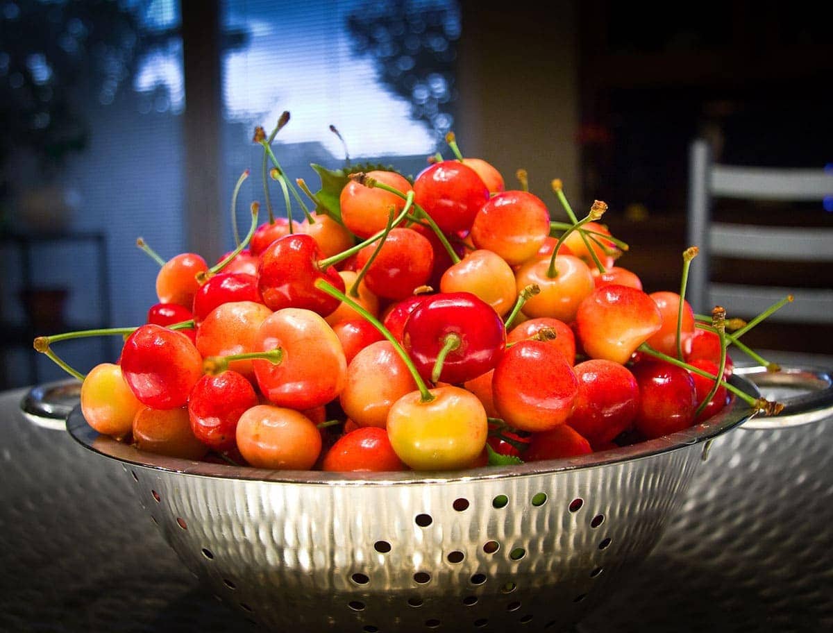 west indian cherry in a silver bowl on wooden background
