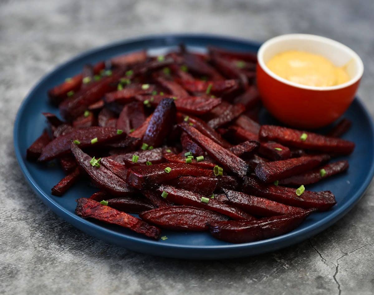 best beet fries on a blue plate on grey background