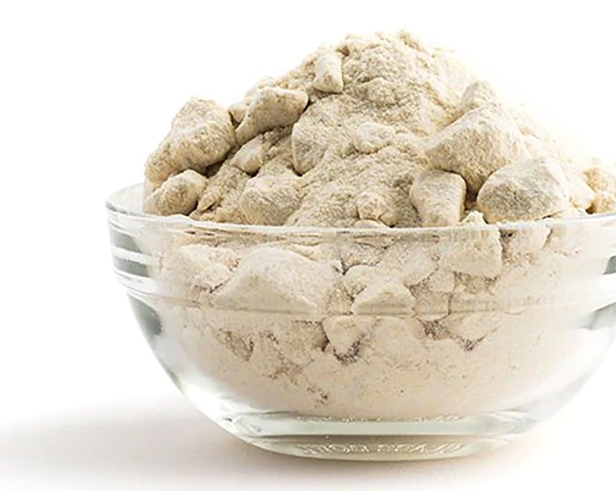 yacon sugar in a glass bowl on a white background