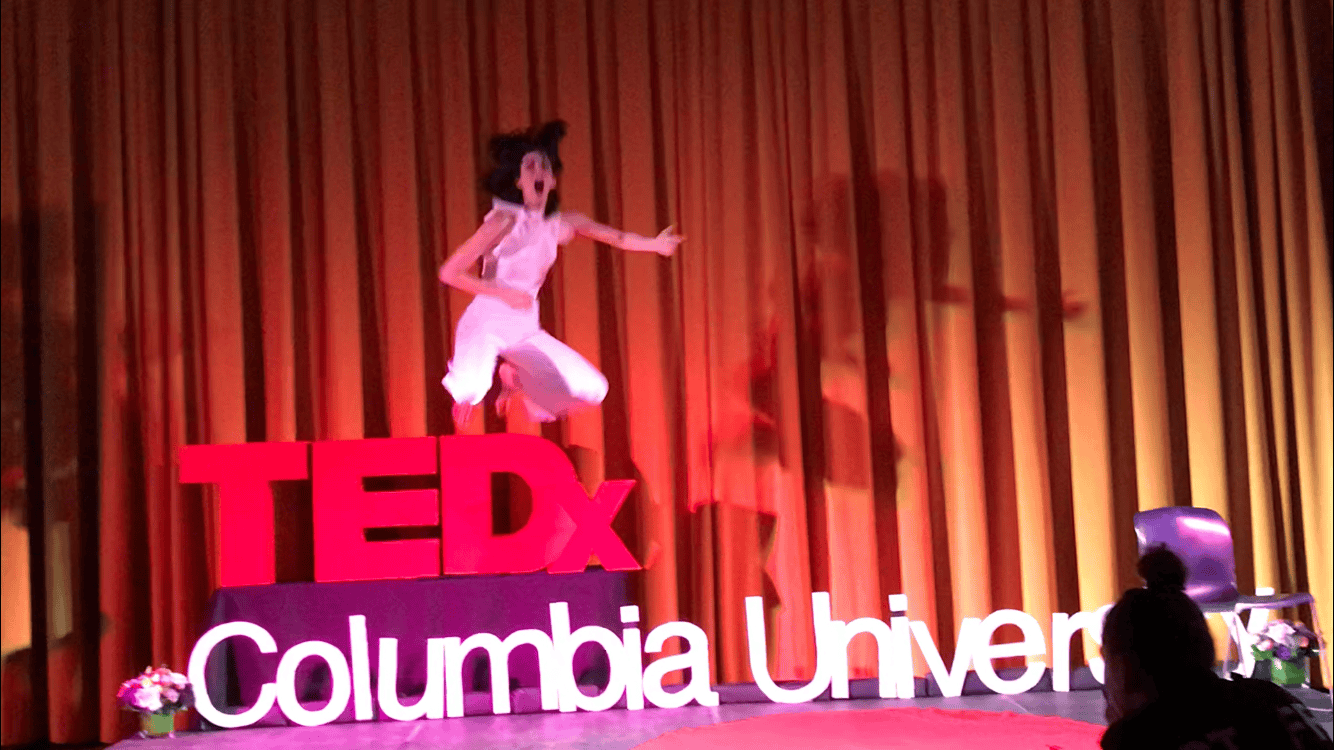 Marquina flying over TEDx Sign - Air Guitar
