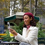 How to Spot Red Flags in Online Dating: Protect Yourself and Find Genuine Connections 14 an attractive business woman checking her cell phone in the city she could be text messaging or even browsing the web via wi fi or a 3g connection rtgq1dCBo