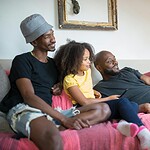 a family watching on the living room