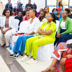 A diverse audience attends Style, Shop & Sip with Connie Oluoch in the shopping mall.