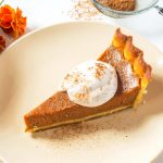 Slice of Gluten Free Dairy Free Pumpkin Pie on a plate