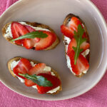 Strawberry Ricotta Bruschetta on a pink plate