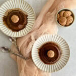 Bonet in 2 plates with spoons and cookies