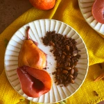 Red-Wine-Poached-Pears-with-Chocolate-and-Pumpkin-Crumble on a white rimmed plate
