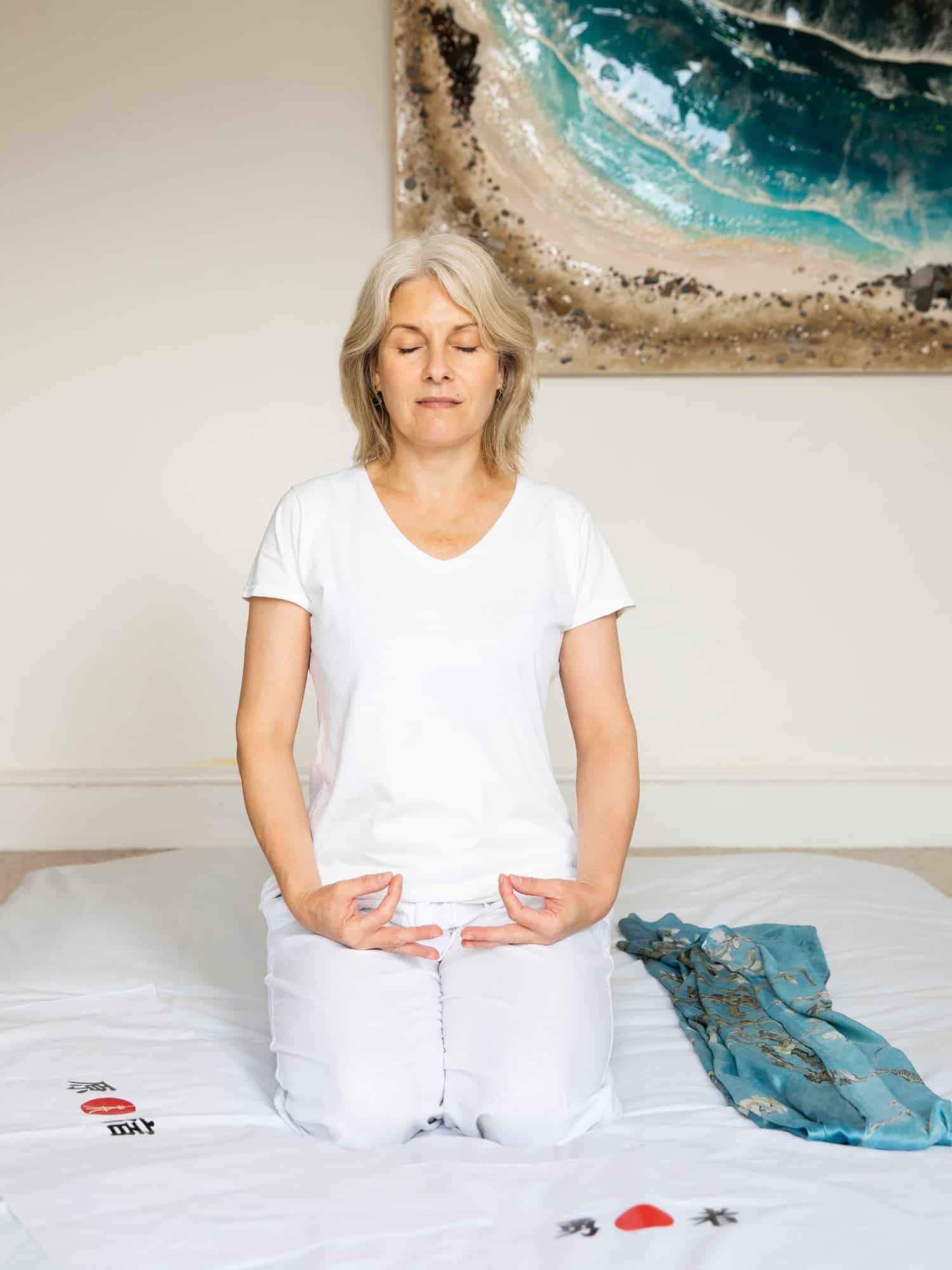 Ludmila meditating at her massage studio in West Kirby, Wirral.