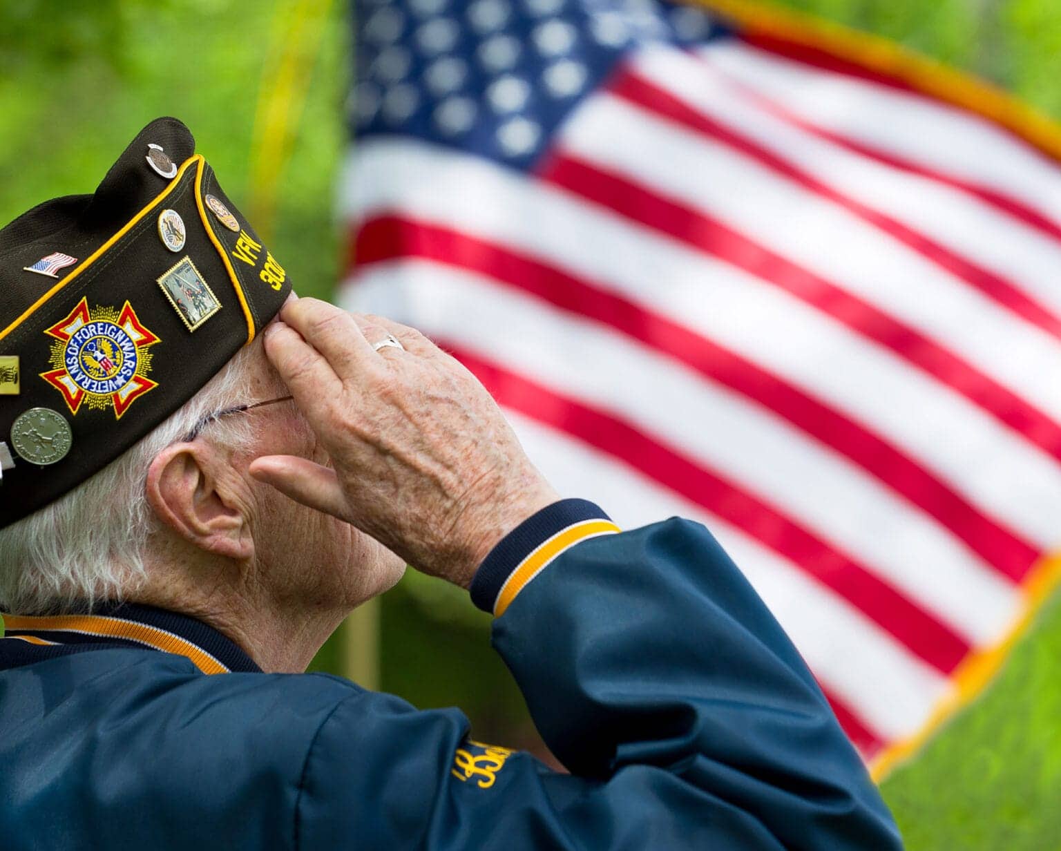 Veteran Saluting US Flag