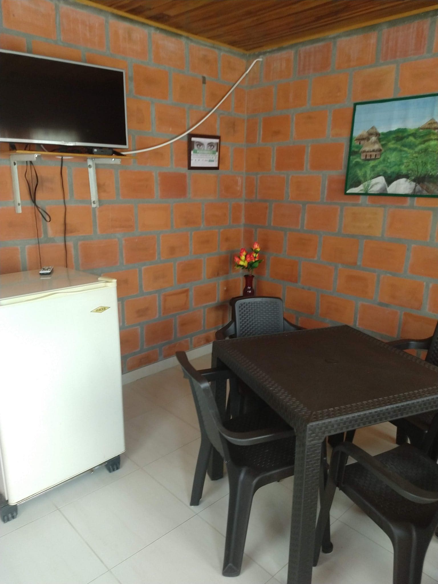 Our Two Wonderful Nights in Minca, Colombia 3 The entrance with TV and fridge at Cabanas el Descanso y Zamukia