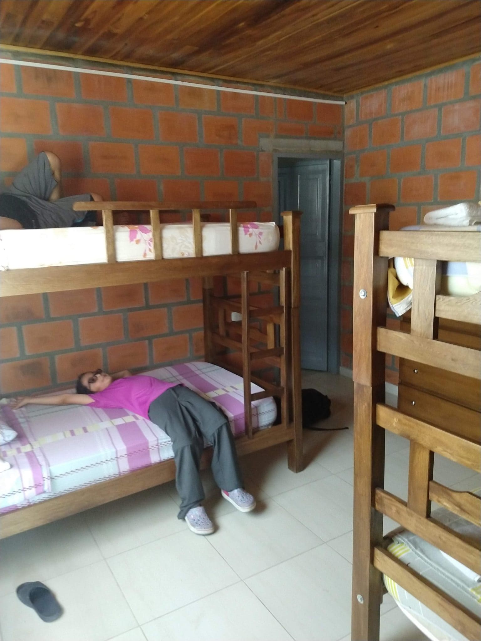 Our Two Wonderful Nights in Minca, Colombia 4 Daniela on a bed at Cabanas el Descanso y Zamukia