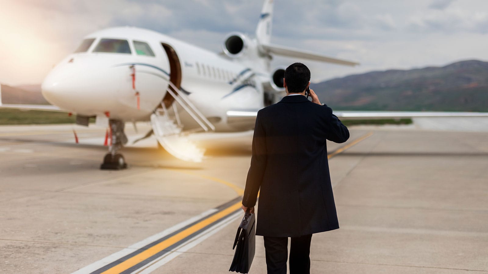 Aircraft Broker in front of airplane