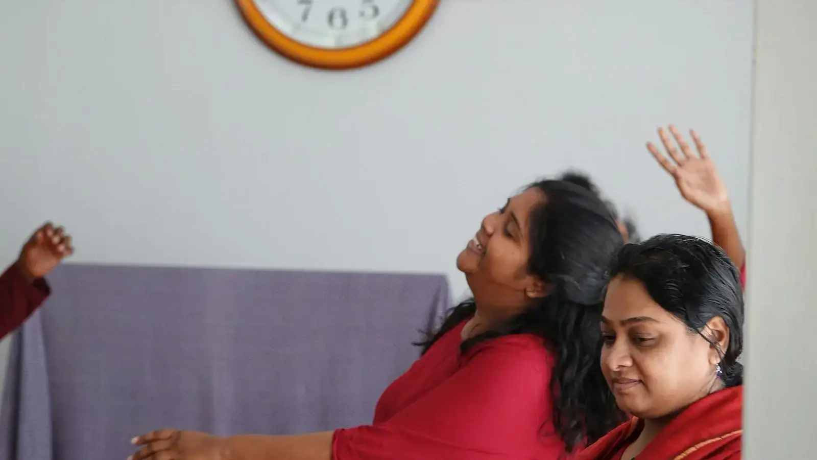 a person raising the hand