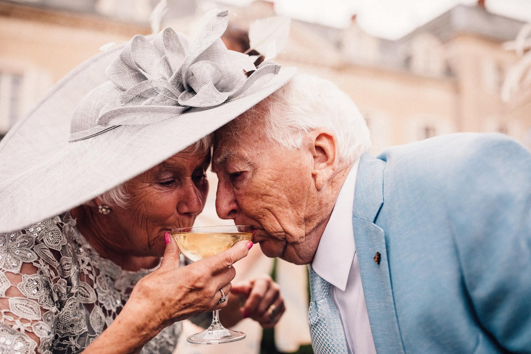 nan and grandad sharing champagne glass