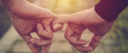 Two people holding hands
