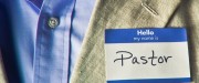 man wearing "Hello, my name is Pastor" sticker