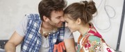 Happy couple with floor plan