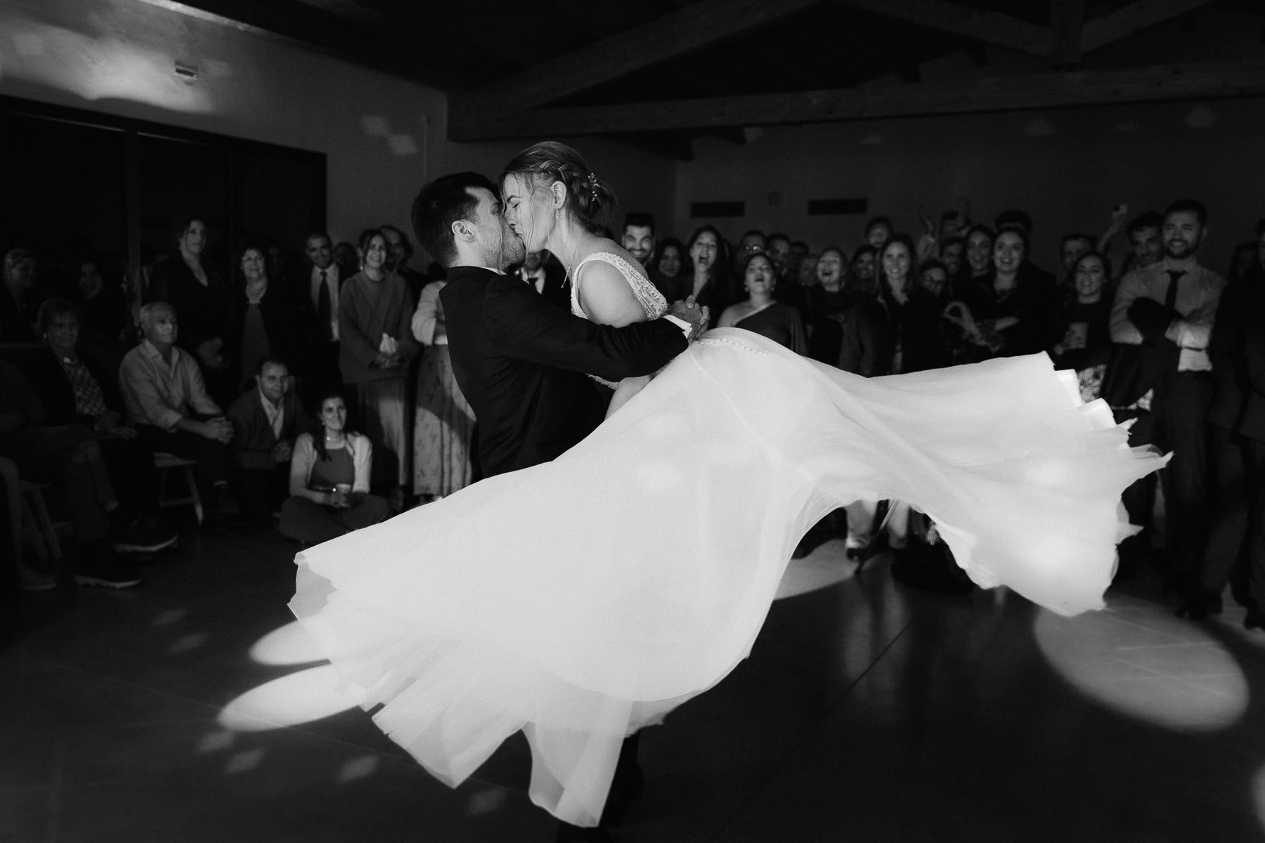 Bride and groom performing a spectacular lift during their first dance
