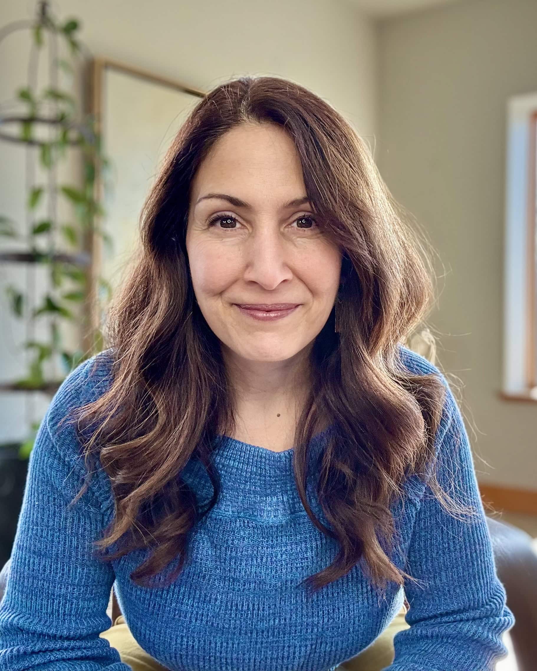 Jodi Aman smiling to camera with blue shirt on, Doctor of Social Work Code of Ethics
