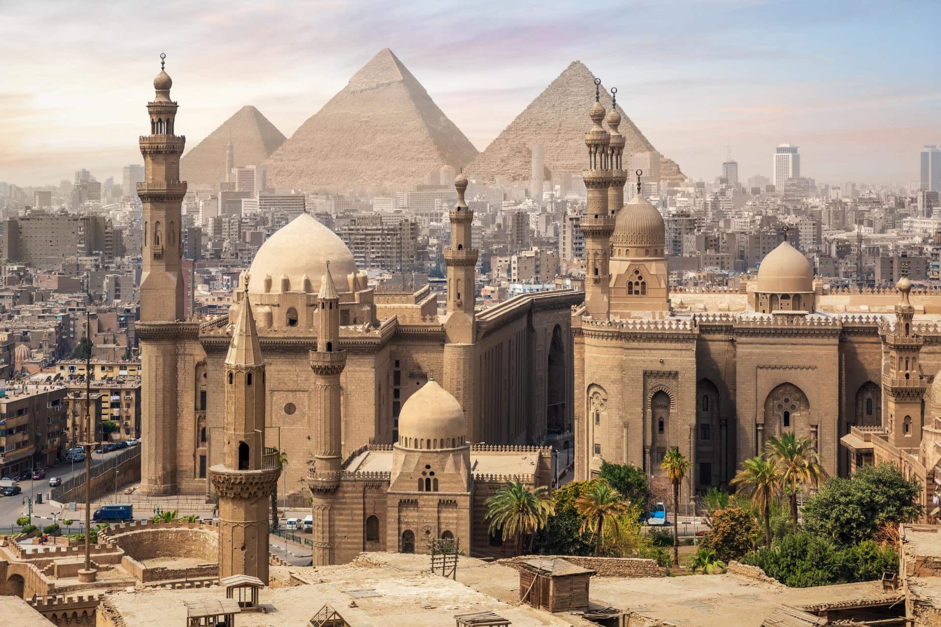 The Mosque of Sultan Hassan and the Great Pyramids of Giza, Cairo skyline, Egypt