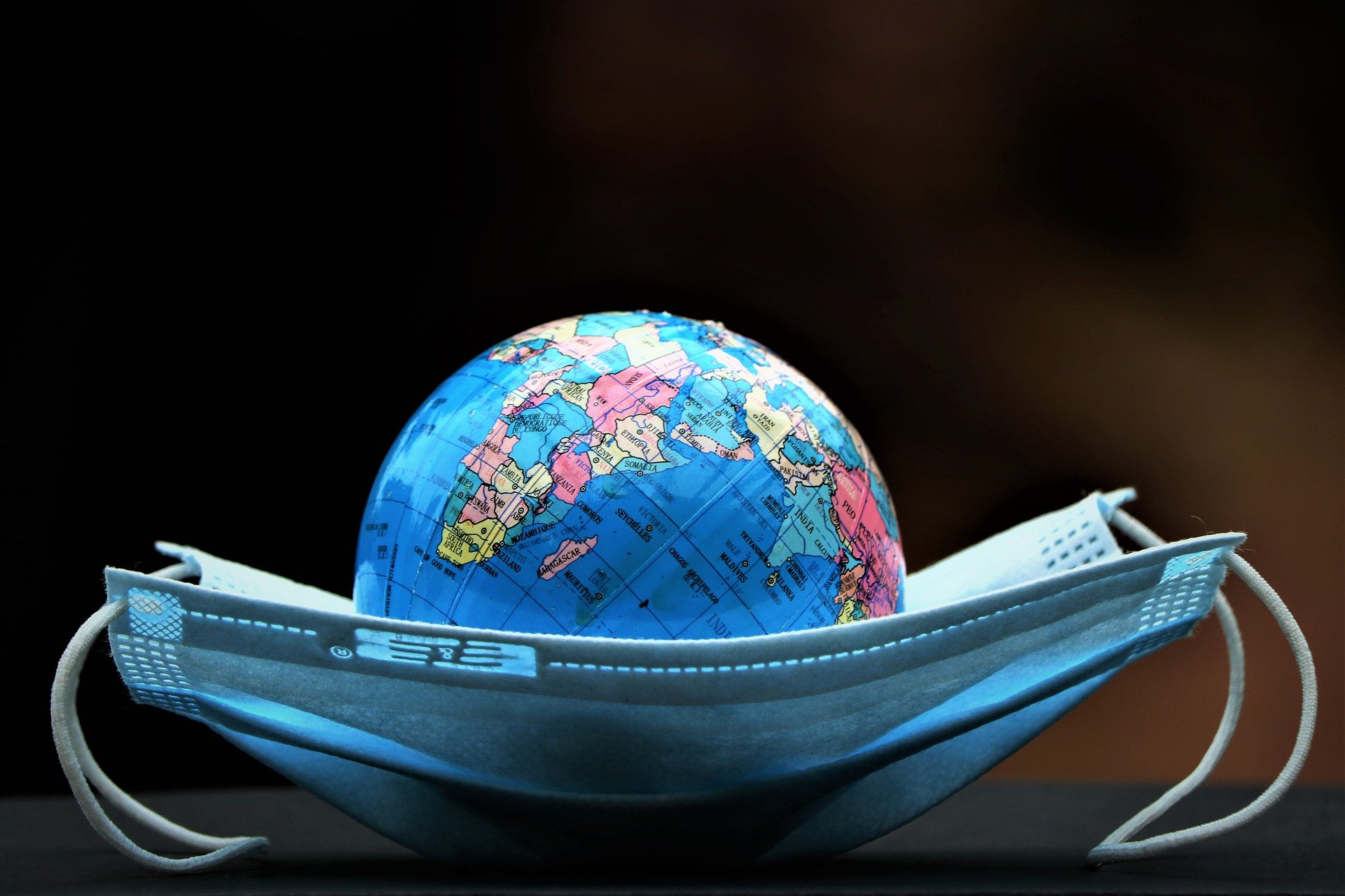 The earth model lying on the blue medical mask.