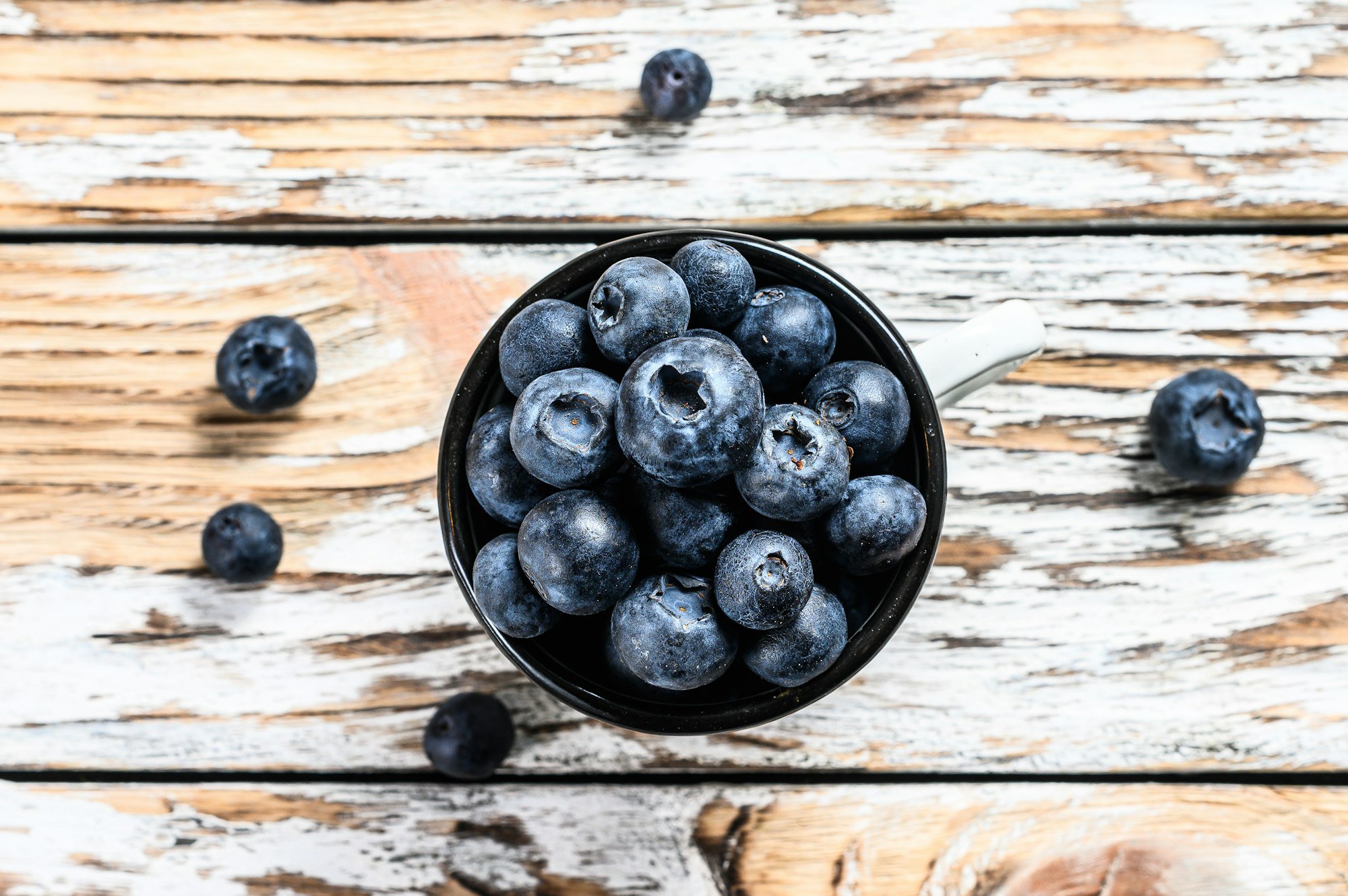 Blueberry in a white cup. antioxidant organic superfood. concept for healthy eating.