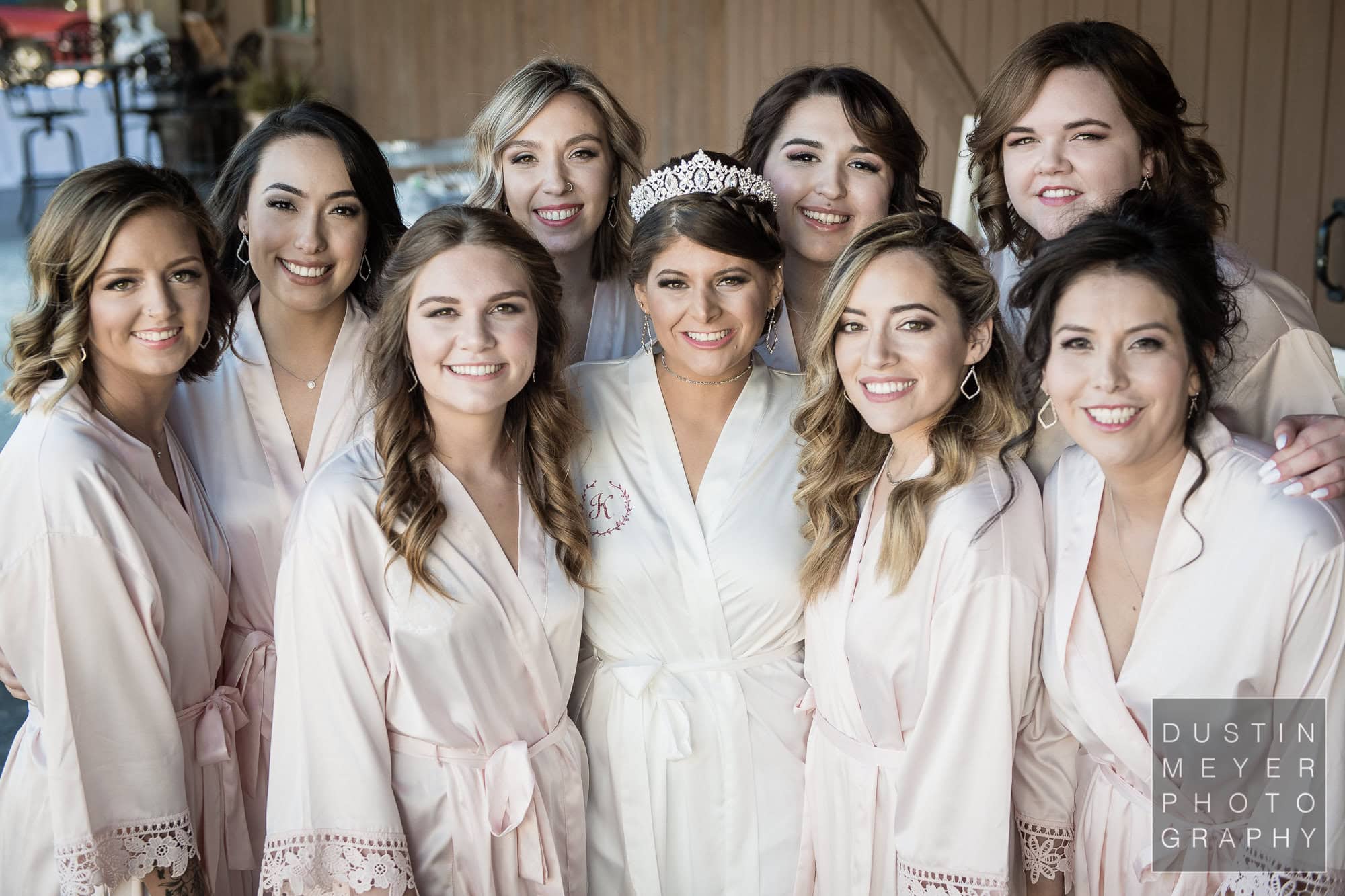 The bride and her bridesmaids in their matching wedding day robes