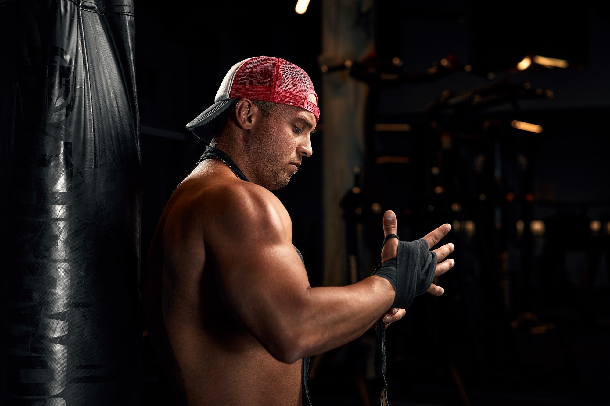 Strong athletic fitness men pumping up arm muscles workout barbell curl. Fitness concept background