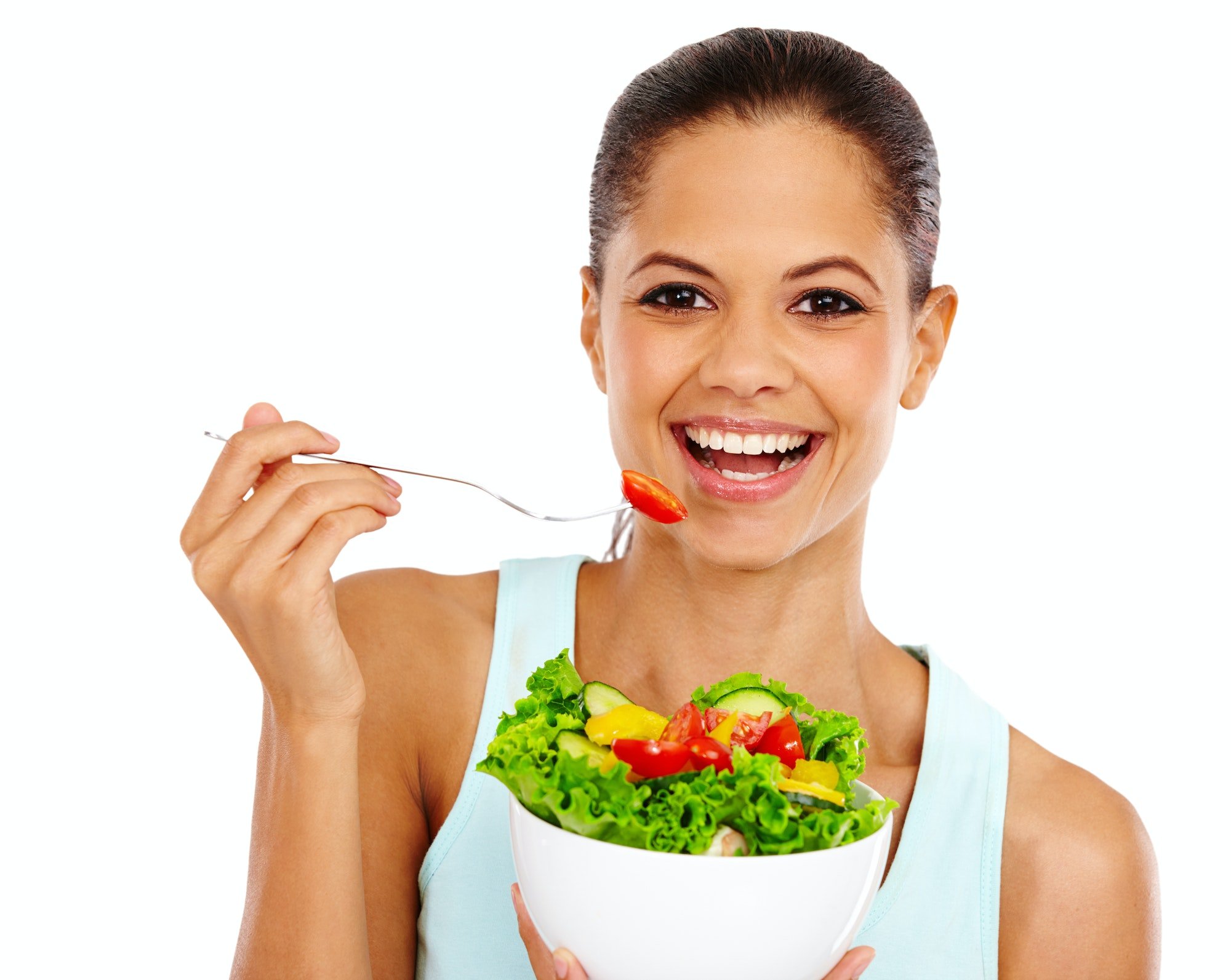 Eating healthy. Portrait of an attractive young woman eating a healthy salad.
