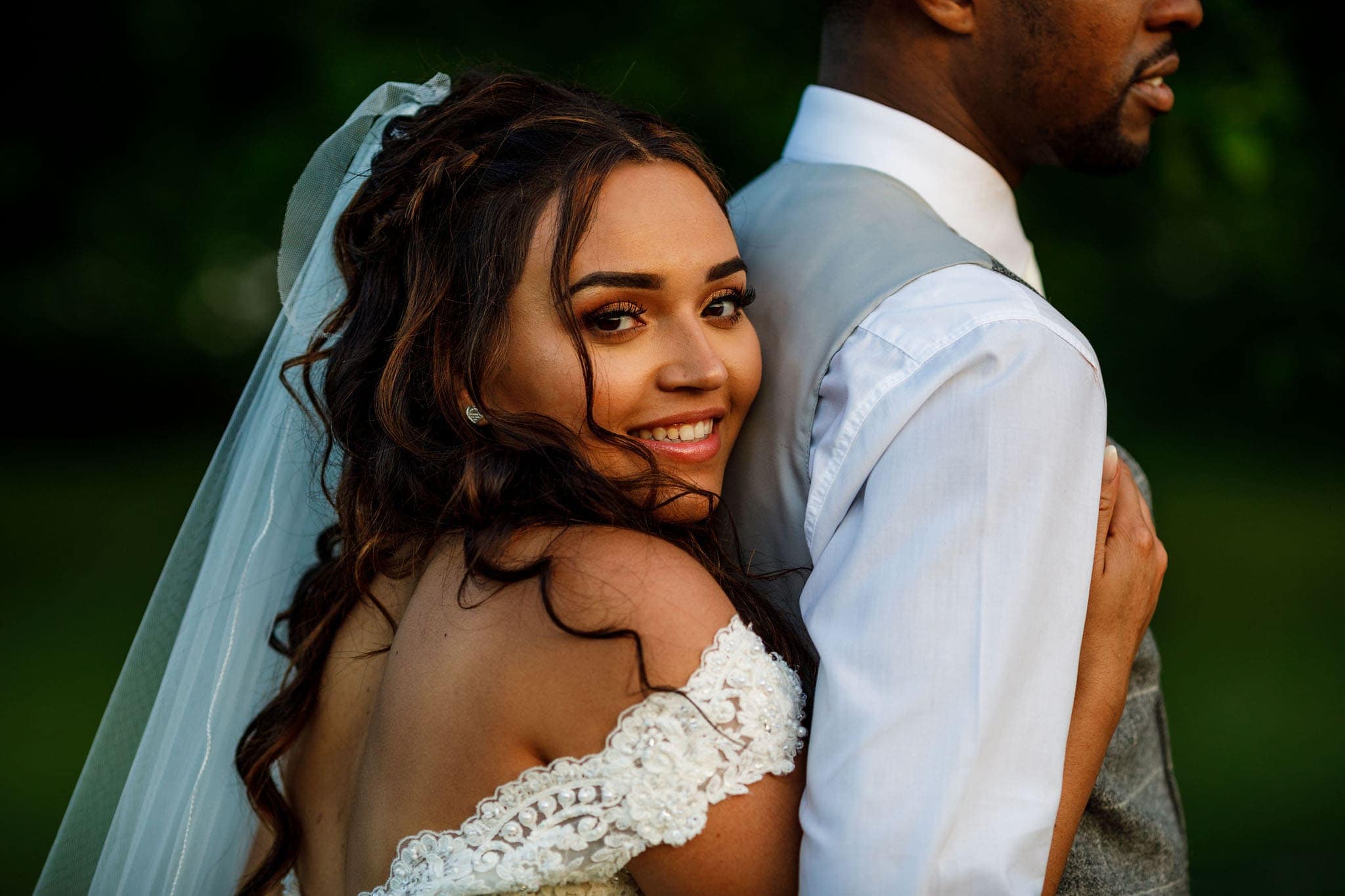 the bride hugging the groom