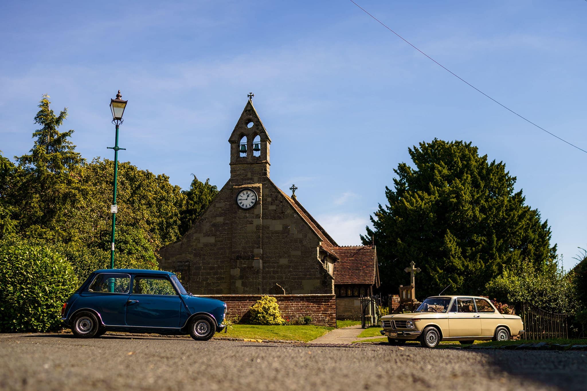 classic cars parked outside Holy Trinity church in Norton Lindsey