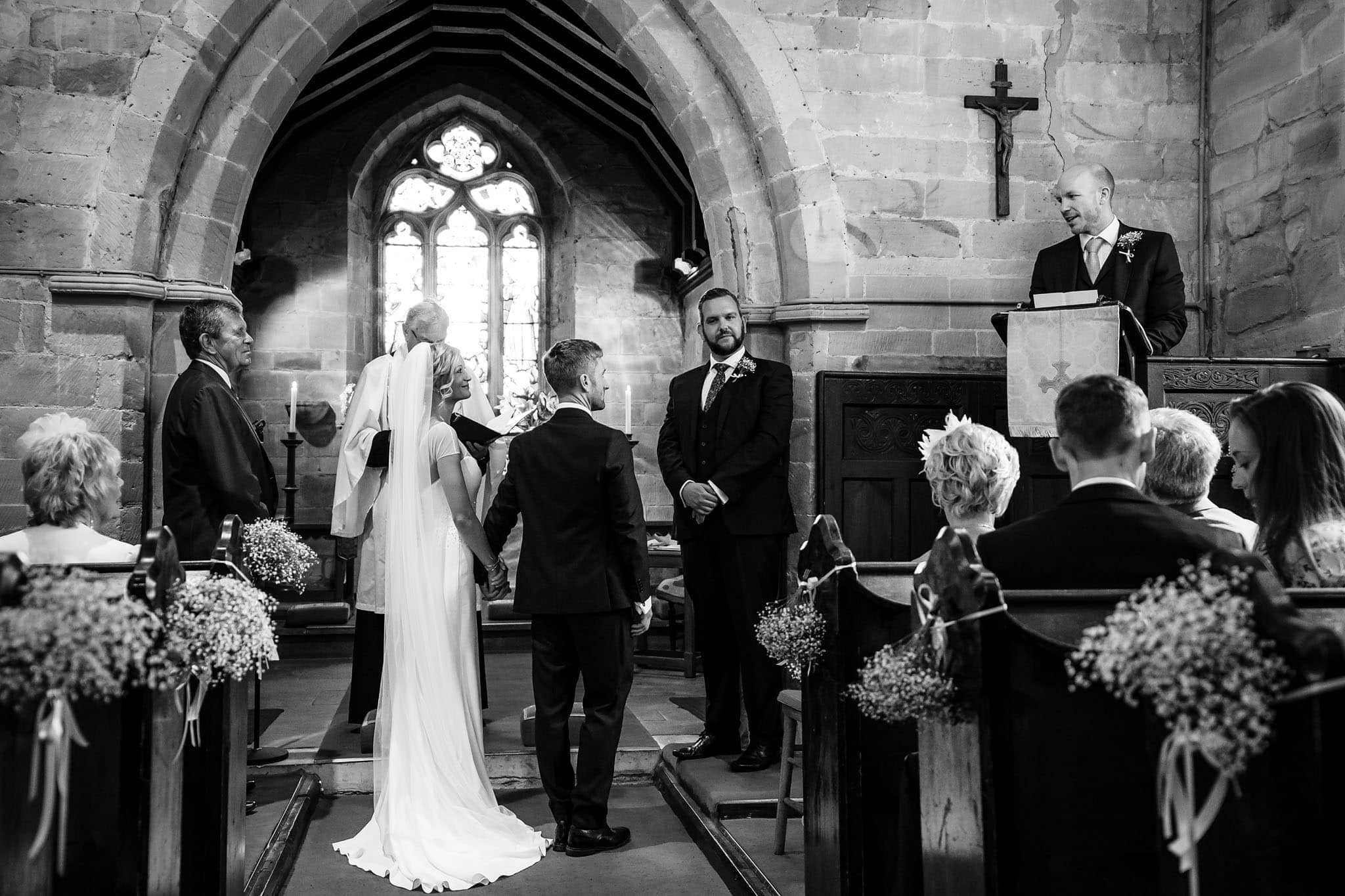 wide shot during a reading in the church
