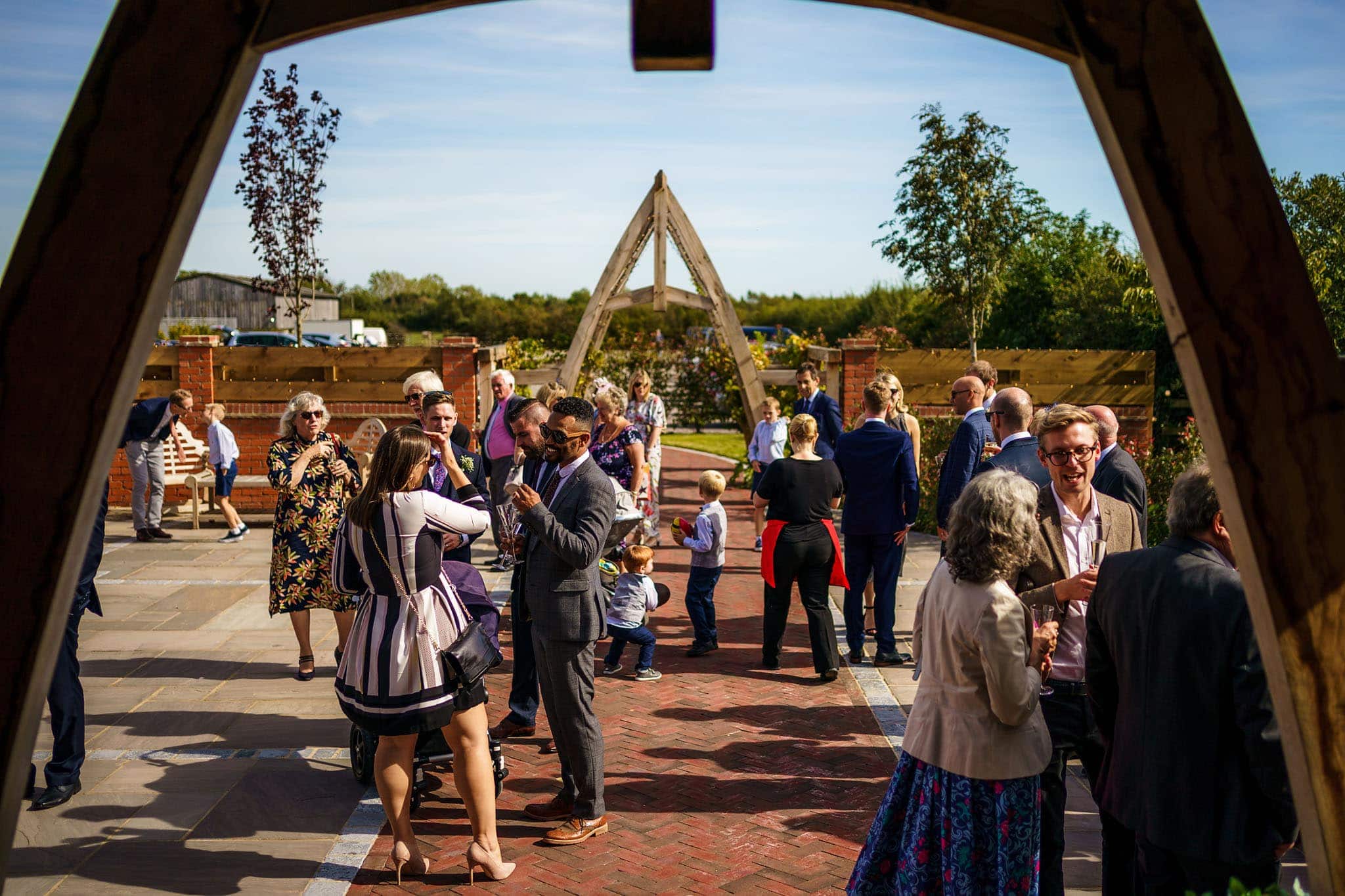 wide shot of guests enjoying drinks reception at Cider Mill Barns