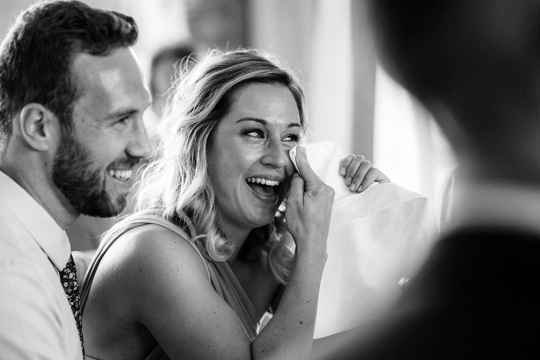 bridesmaid getting emotional whilst listening to the speeches