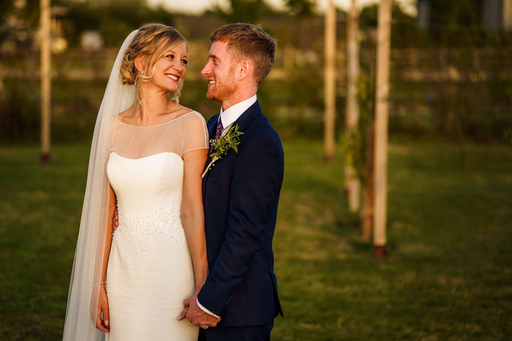 photo of the bride and groom in the summer evening light