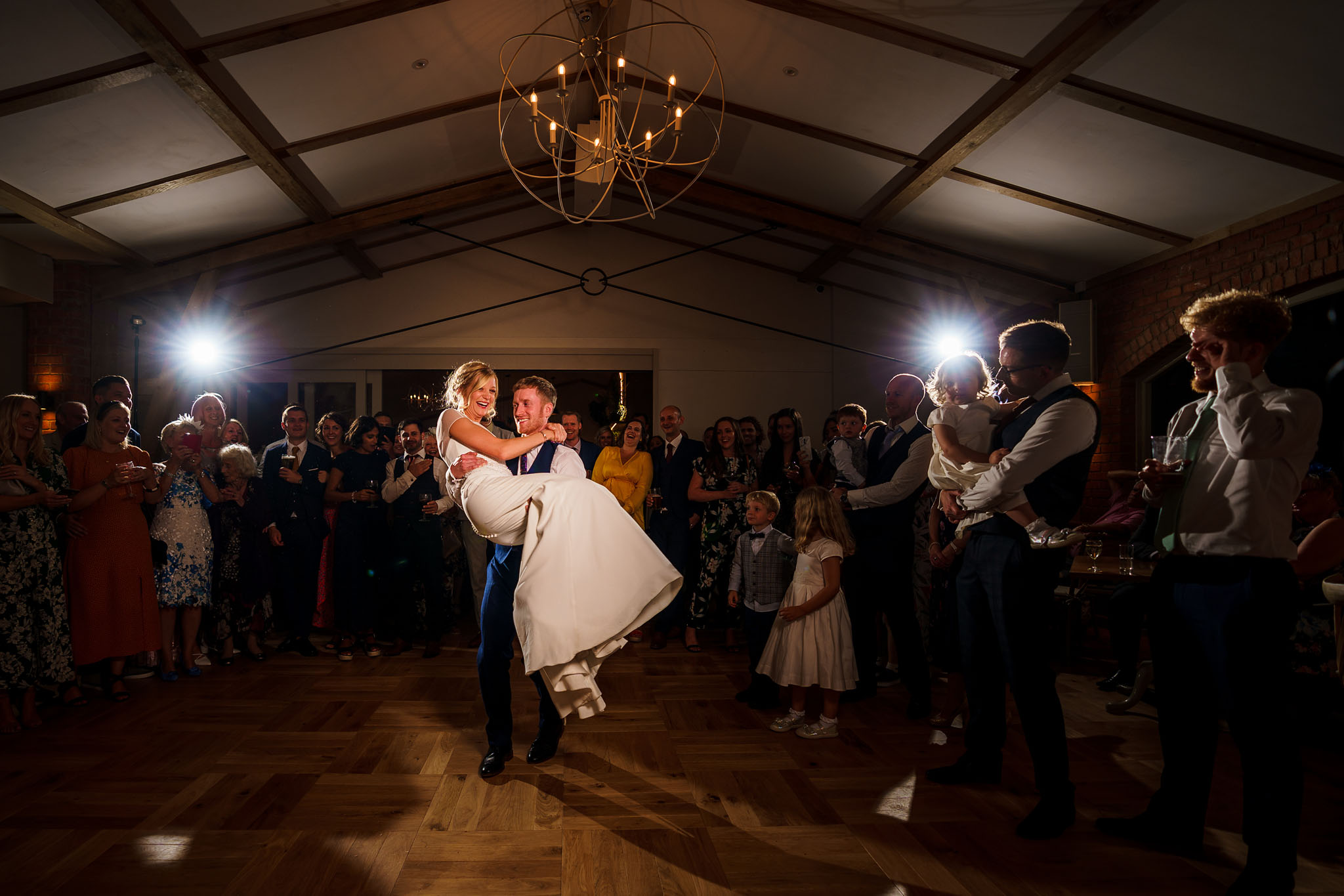 groom spinning his bride around during their first dance