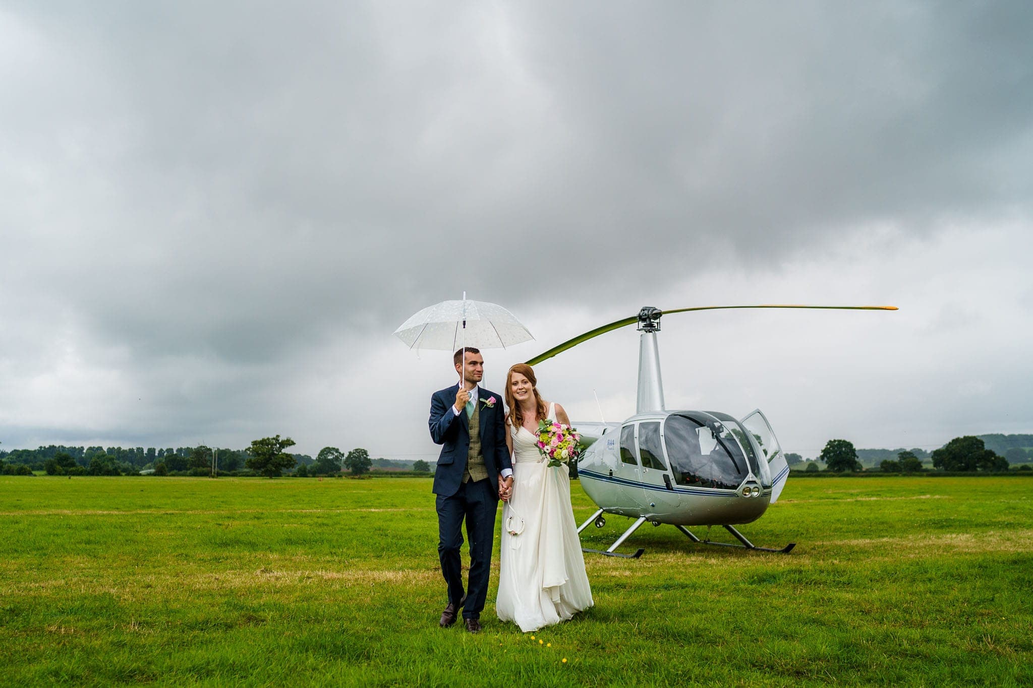 bride and groom arriving in a helicopter