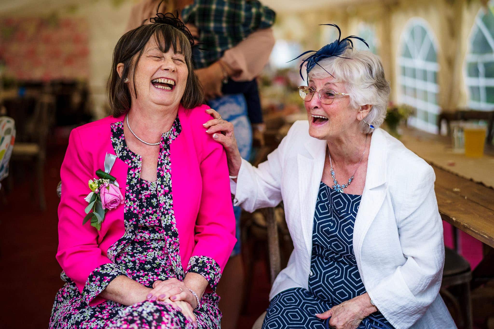wedding guests laughing during the reception