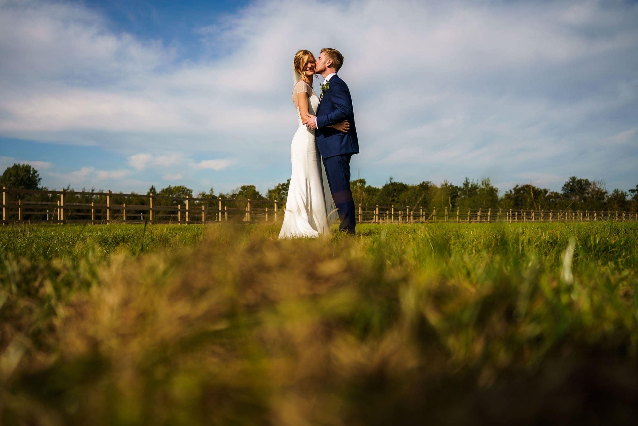 shot of the bride and groom in the summer sun