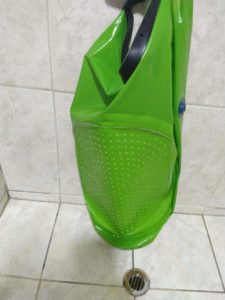Inside out SCRUBBA on a white tiled background