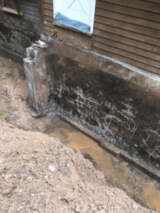 before waterproofing a basement