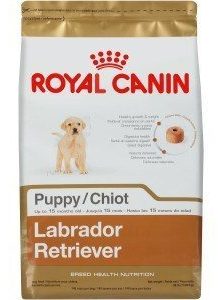 Bag of Royal Canin Labrador Retriever Puppy on white background