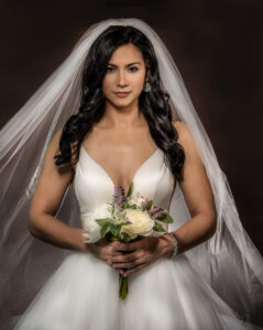 Elegant bridal fine art portrait of a bride holding a bouquet in a studio setting photographed by Atlanta portrait photographer Diego Salcedo.