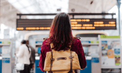 woman wearing spirit personal item at airport