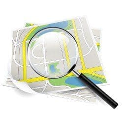 An animated magnifying glass held over a map