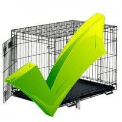 When to use a dog crate - Large green tick on a dog crate