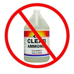 A bottle of ammonia based cleaner in a do not use red circle