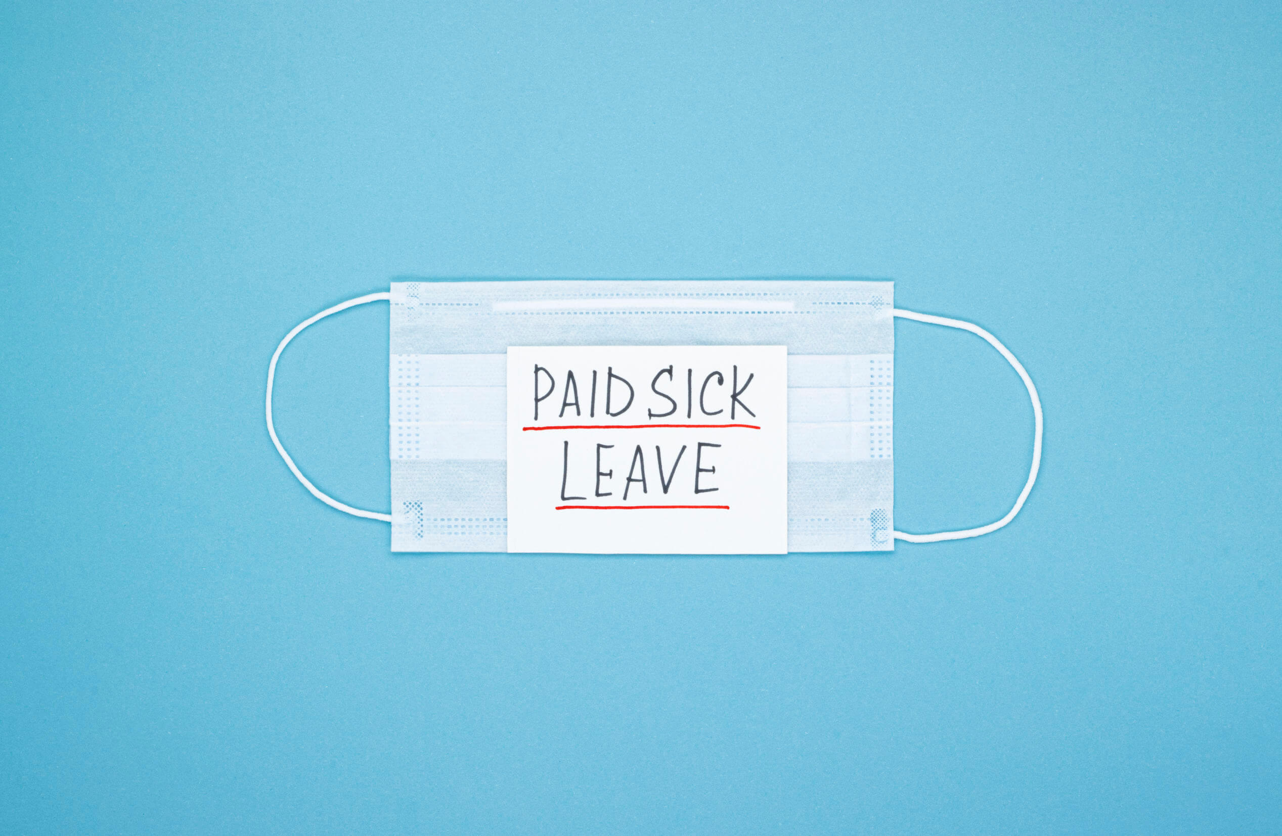 Surgical mask with "paid sick leave" note